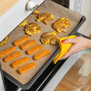 Baking tray with plant-based nuggets and roasted potatoes in oven, WELAZA UAE